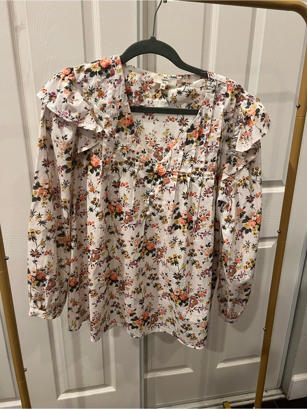 Long sleeve light ruffle shirt. Very feminine great with jeans